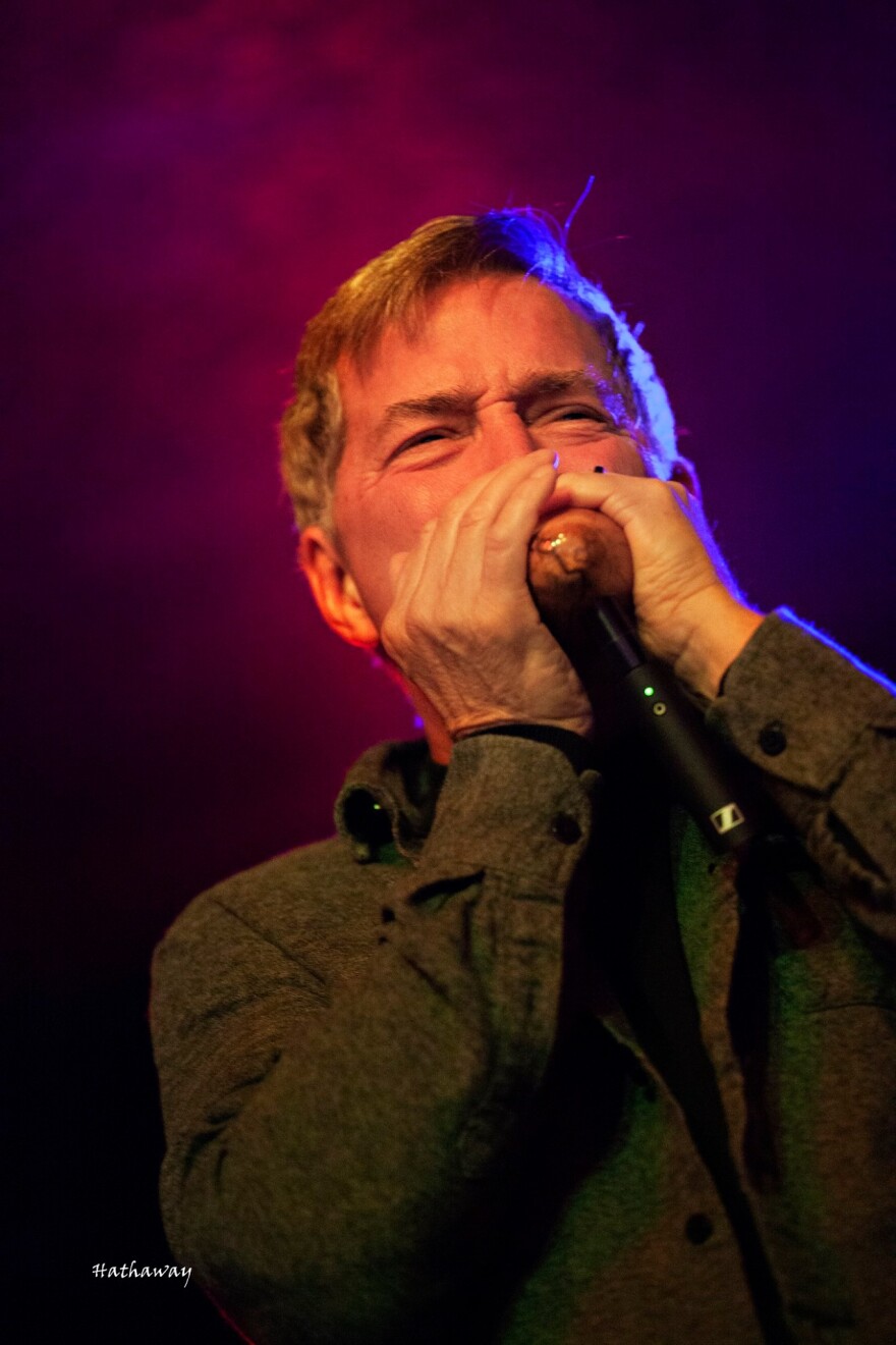 Northeast Ohio musician Dan Bode plays the harmonica, or "harp", at a performance in Seattle.