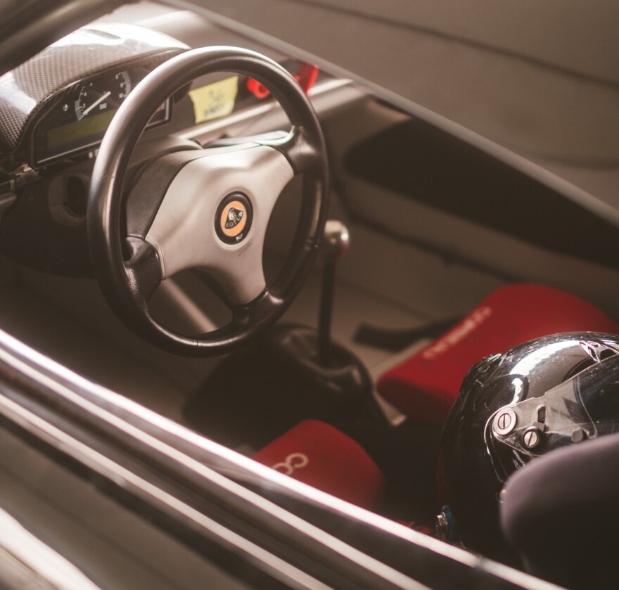 Behind the wheel of a race car.