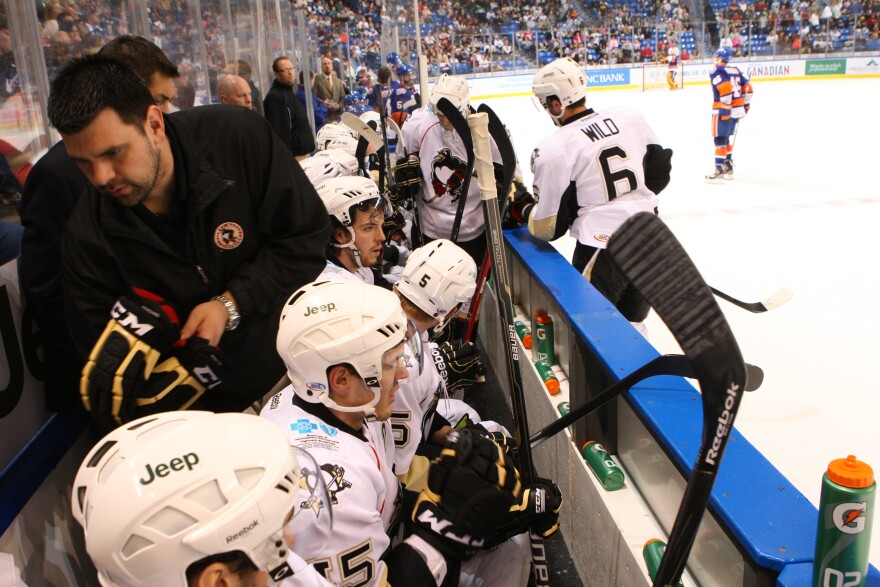 Teddy Richards, standing, left, holds a pair of