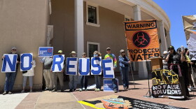 Protesters gather outside the New Mexico Statehouse to denounce a proposed rule for the treatment and recycling of oil-industry fracking water, Monday, May 6, 2024, in Santa Fe, N.M. Environmental officials in the nation's No. 2 state for petroleum production are taking initial steps toward regulating the treatment and reuse of oil-industry fracking water. New Mexico has been grappling with scarce water supplies, and fossil fuel producers are confronting shrinking opportunities for water disposal. The state's Water Quality Control Commission opened a weeklong series of hearings on Monday, May 13. (AP Photos/Morgan Lee)