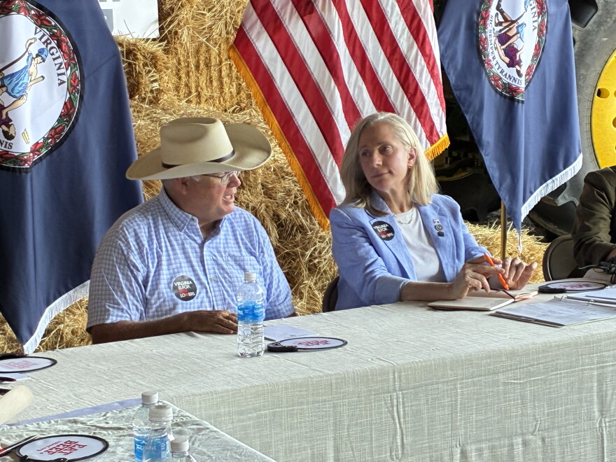 Gene Copenhaver (left), president of the National Cattlemen's Beef Association, speaks with Virginia Gov. Abigail Spanberger.