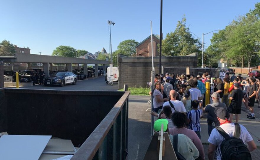 Protesters outside Schenectady Police HQ Monday evening 