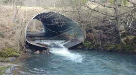 A problematic culvert is pictured along a wildlife trail creek.