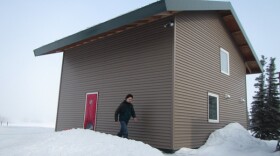 UAF Professor Tom Marsik, who now teaches at the Bristol Bay Campus, at his home in Dillingham. The 600-square-foot, extremely energy-efficient house has been certified as the world's most airtight house. (Credit KDLG)