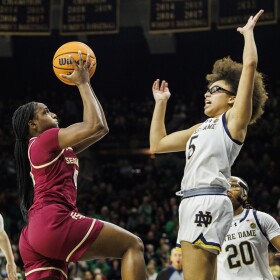 Florida State guard Ta'Niya Latson (00) drives as Notre Dame guard Olivia Miles (5) defends during the second half of an NCAA college basketball game Thursday, Feb. 27, 2025, in South Bend, Ind. (AP Photo/John Mersits)