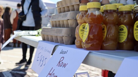 raw honey and eggs sit on a table at 2nd Street Market outdoor farmers market opening weekend and MayFair Plant Sale
