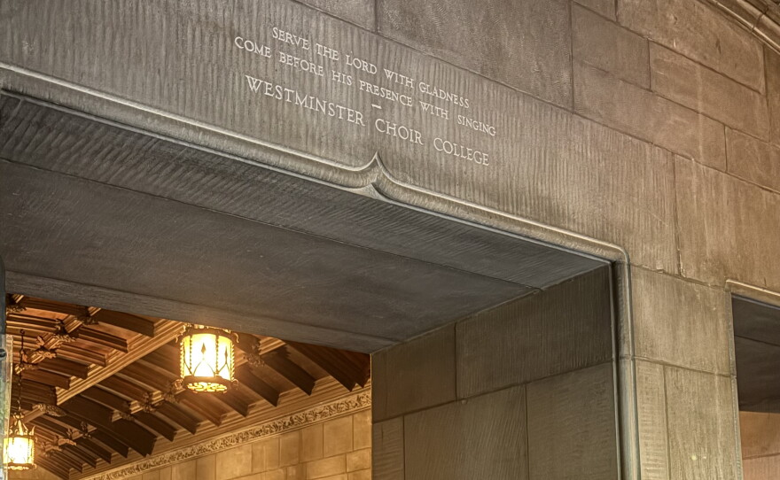 The procession traditionally passes through this arch, with an inscription dedicated by past WCC alumni: "Serve the Lord with Gladness; Come before his Presence through s