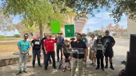 Supporters with the National Alliance Against Racist & Political Repression in Dallas stage their speech across the street from Dallas City Hall after being told to relocate.