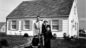 Truck supervisor Bernard Levey with his family in front of their home in the then-new Levittown, Pa., housing development in 1950.