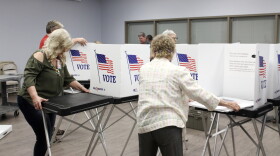 Volunteers and staff set up the early voting site at the Hillsborough County Supervisor of Elections office off Falkenburg Road on Friday.
