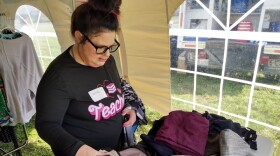 Before speaking to several potential employers, Amie Cipollone picks out clothes donated for Leadership Lexington's "Look good, feel good" job fair.