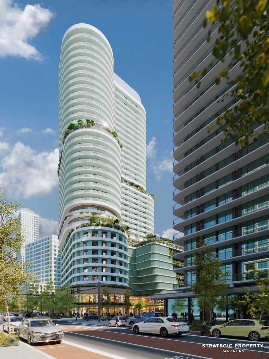 Rendering of a tall, white, oblong building with greenery on two of its floors.