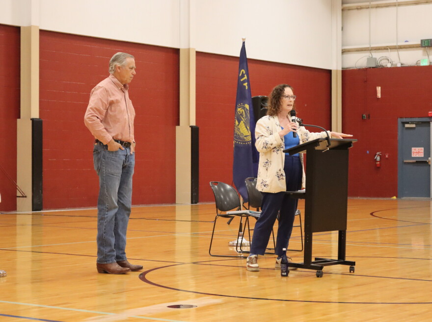 U.S. Representative Val Hoyle speaks to a crowd at a town hall alongside U.S. Senator Jeff Merkley, left, in September of 2026.
