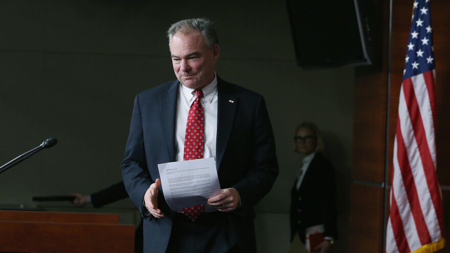 Sen. Tim Kaine walks up to speak at a news conference in 2015.