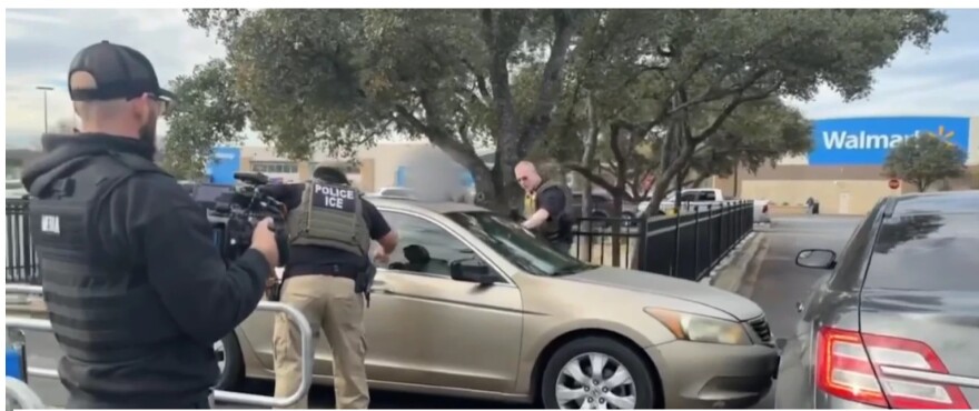 ICE agents approach a man who used his car to ram into two other cars at a Walmart Supercenter along Blanco Road near Wurzbach Parkway in San Antonio