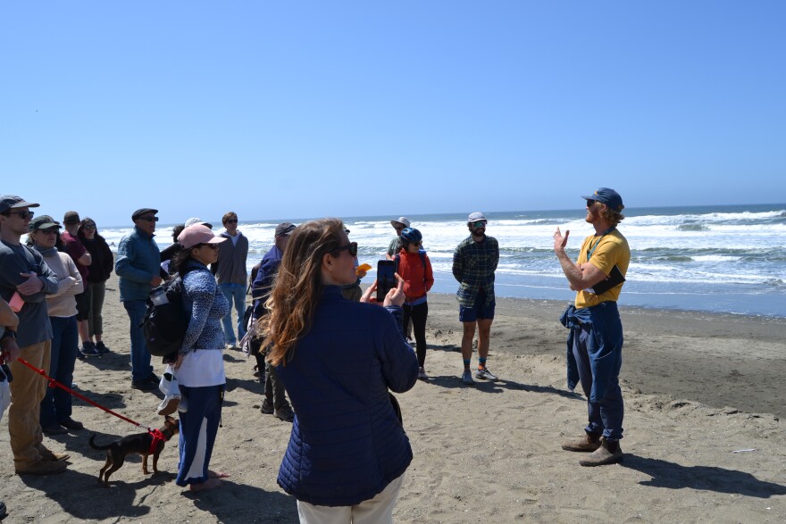Chase Davenport talks to the crowd during his tour of Sunset Dunes
