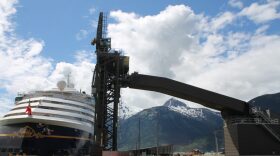 The Disney Wonder cruise ship docks near the ship loader at Skagway's ore terminal.