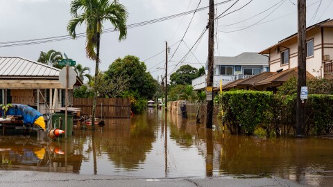 Streets are flooded from severe rains, Friday, March 20, 2026, in Haleʻiwa, Hawaiʻi.