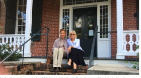 Karen and Ann sit on the porch of Albert J. Pickett's family home.