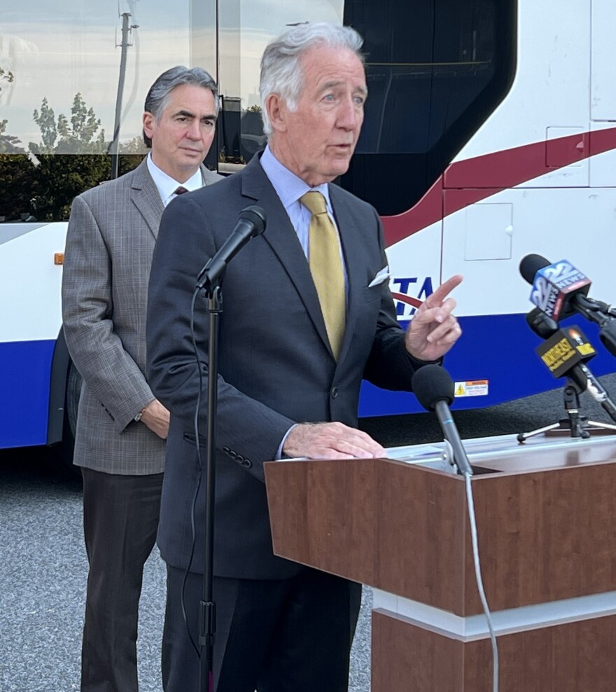 U.S. Representative Richard Neal addresses a press conference as Springfield Mayor Domenic Sarno looks on.