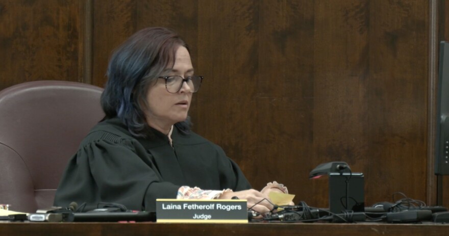 Vinton County Judge Laina Fetherolf Rogers looking over papers at the arraignment of Gary Siders Jr. and Sr.