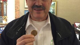 Salvation Army Major Steve Svenson holds a Liberty Head Double Eagle donated to the Salvation Army in Columbia Falls.