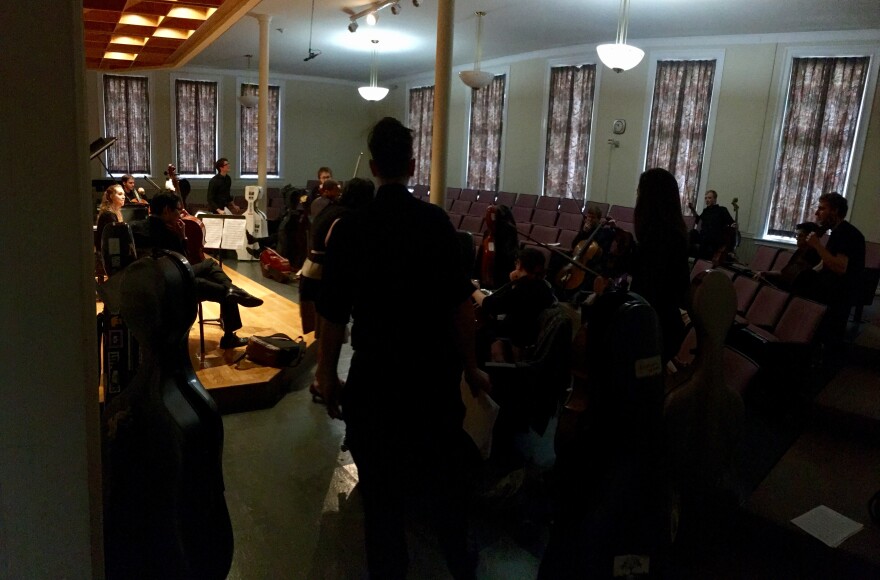 Cellos gathering backstage in the Green Room