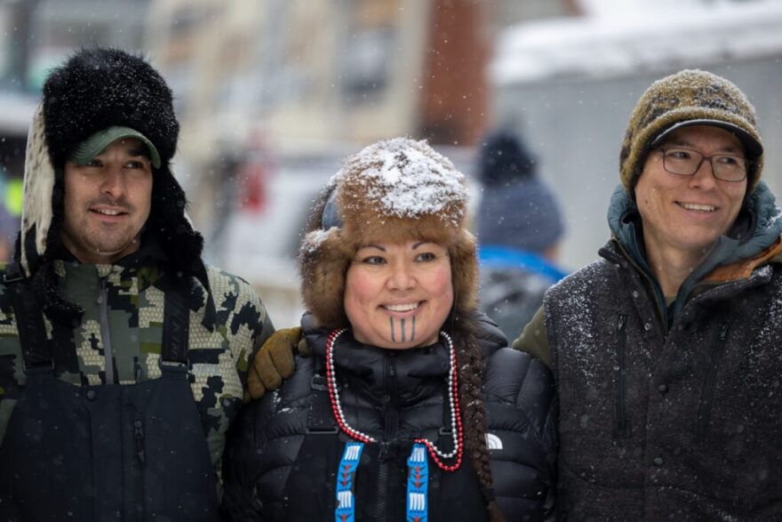 Kevin Hansen, Jody Potts-Joseph and Jesse Terry are rookies in this year's Iditarod, but they're not new to mushing. All three grew up with dog teams in their families and say they draw their strength and love of mushing from their Indigenous heritage and connection to the land. The three posed for a photo on Saturday at the Iditarod ceremonial start.