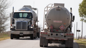Trucks pass each other along a rural road just off south of Kingfisher.