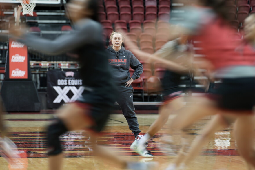 UNLV women's NCAA college basketball head coach Lindy La Rocque watches during practice Wednesday, Feb. 15, 2023, in Las Vegas. La Rocque might be the exception, the coach who stays and tries to build a program at a mid-major even if Power Five athletic directors try to lure her away with offers of more money and greater access to the NCAA tournament.(AP Photo/John Locher)