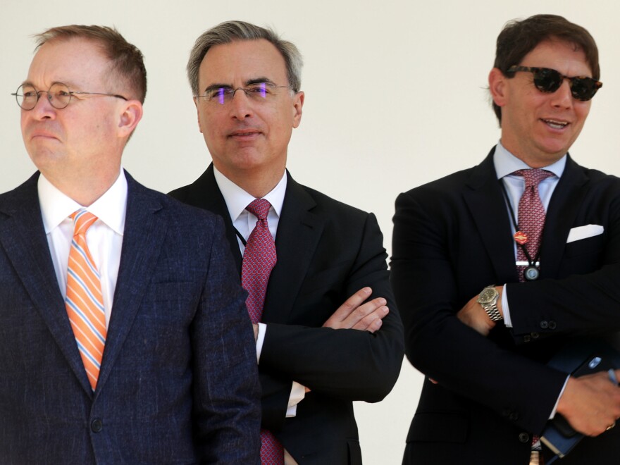 White House counsel Pat Cipollone (center) stands with acting Chief of Staff Mick Mulvaney (left) and spokesman Hogan Gidley in 2019.