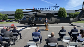 Gov. Ned Lamont speaks at Lockheed-Martin's Sikorsky in May 2022, where he signed a tax incentive agreement between the company and the state.