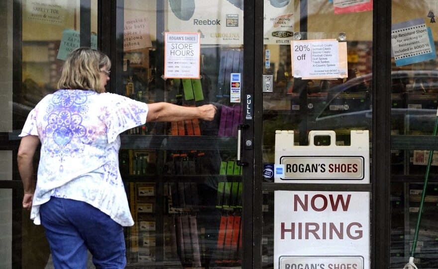 A hiring sign is displayed outside a store in Buffalo Grove, Ill. on June 24, 2021.