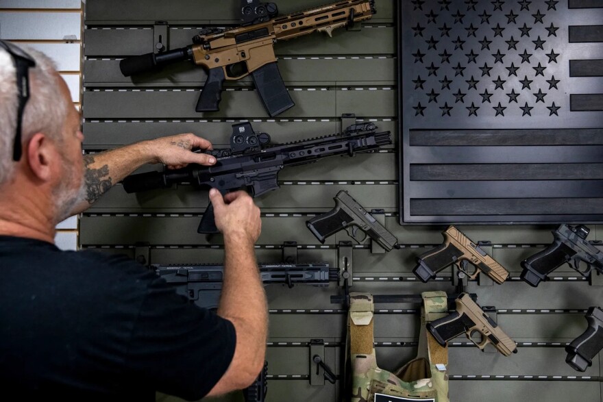 Gunsmith Don Gregory shows off two new single-action firearms recently released by Juggernaut Tactical in Orange on Thursday, Sept. 21, 2023.