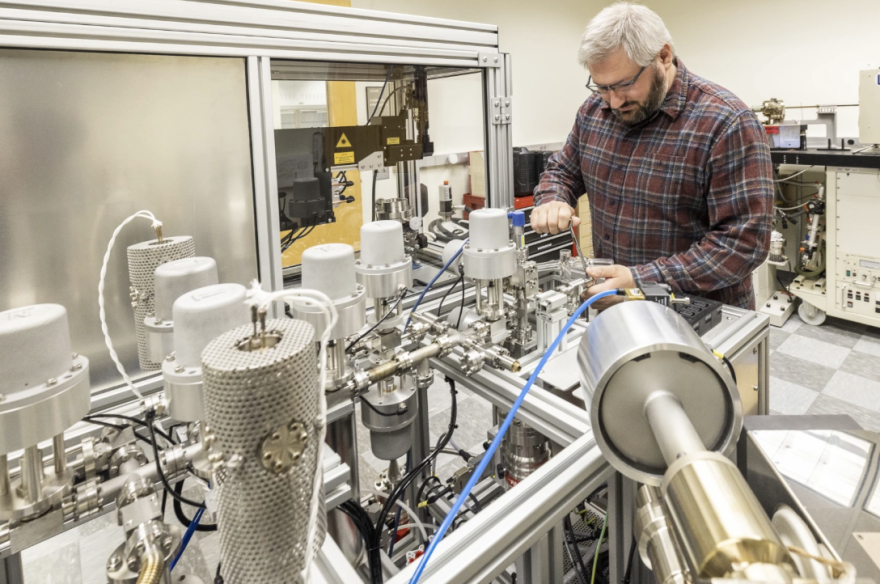UAF geochronologist Florian Hoffman works on the program's argon mass spectrometer.