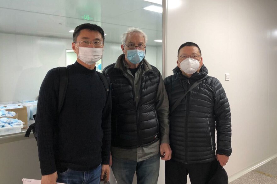 Michael Crotty (center) with Zhang Guangli (left) and Archi Liu, partners for 18 years at Golden Pacific Fashion and Design, a Shanghai curtain manufacturer that now makes masks.