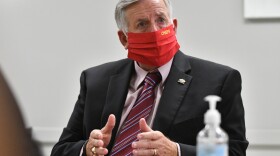 Missouri Gov. Mike Parson talks with team members at ReDiscover Mental Health Service on Aug. 27.