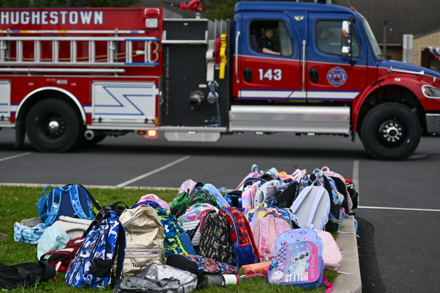 Childrens' bookbags sit outside of the Wyoming Area Catholic School after children were bused to Wyoming Area Secondary School following a fire at the Catholic school on Tuesday, Sept. 1, 2026.