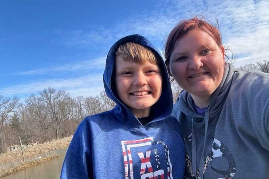 Allison McCammon and her son Teigan are seen taking a selfie together.