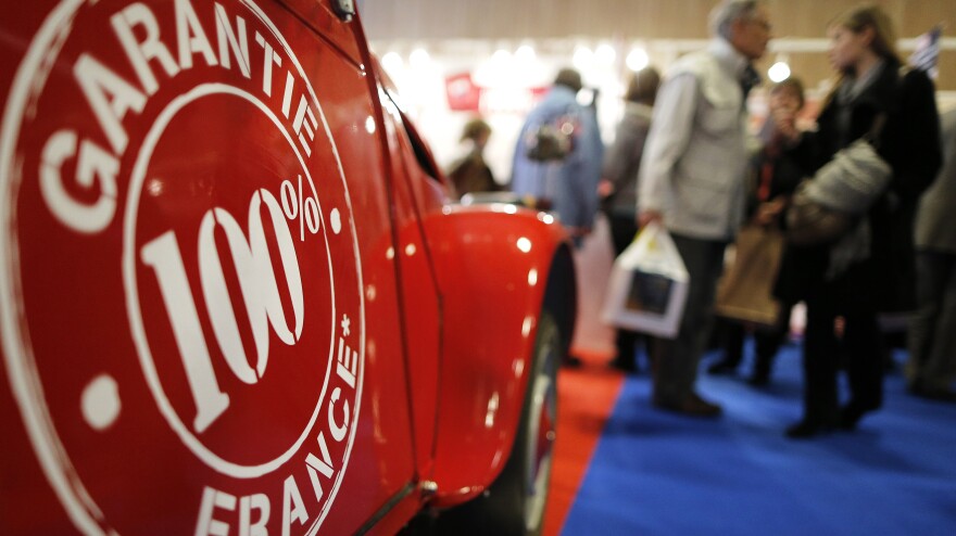 People walk past a Citroen 2CV vintage van at the Made In France fair in Paris on Sunday.