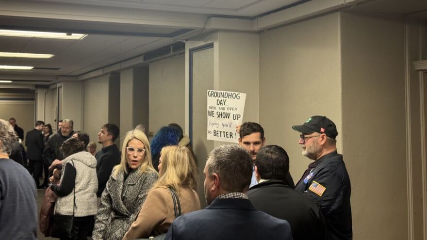 People wait to testify on the immigration bill Monday, February 2nd at the Statehouse.