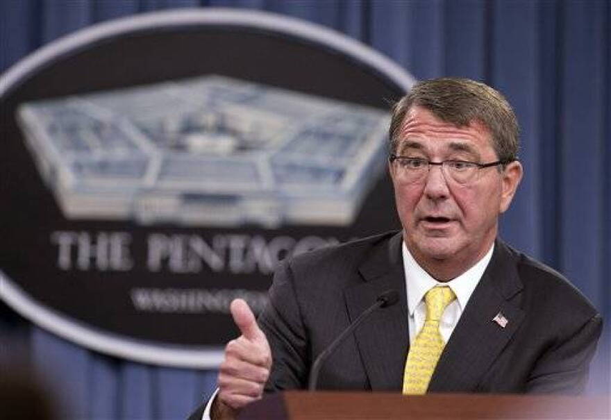 In this Aug. 20, 2015 file photo, Defense Secretary Ash Carter speaks during a news conference at the Pentagon. Carter spoke with his Russian counterpart Friday, the first step in direct military talks proposed by Russia about Moscow's military buildup to support the Syrian government against the Islamic State group.