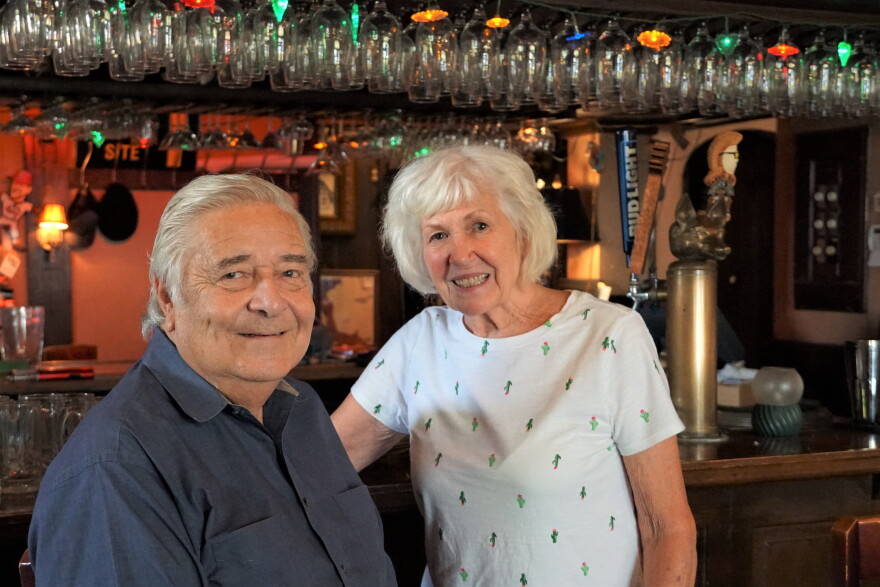Sue and Marty Luepker lean up against the bar of their bavarian-style restaurant in Dutchtown. The couple is retiring after 25 years operating the Feasting Fox, and they hope someone else will take it over.
