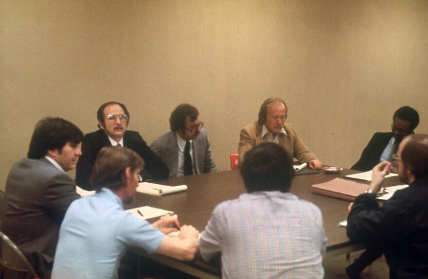 Negotiators with the Town of Normal and Normal firefighters at the bargaining table with a federal mediator.