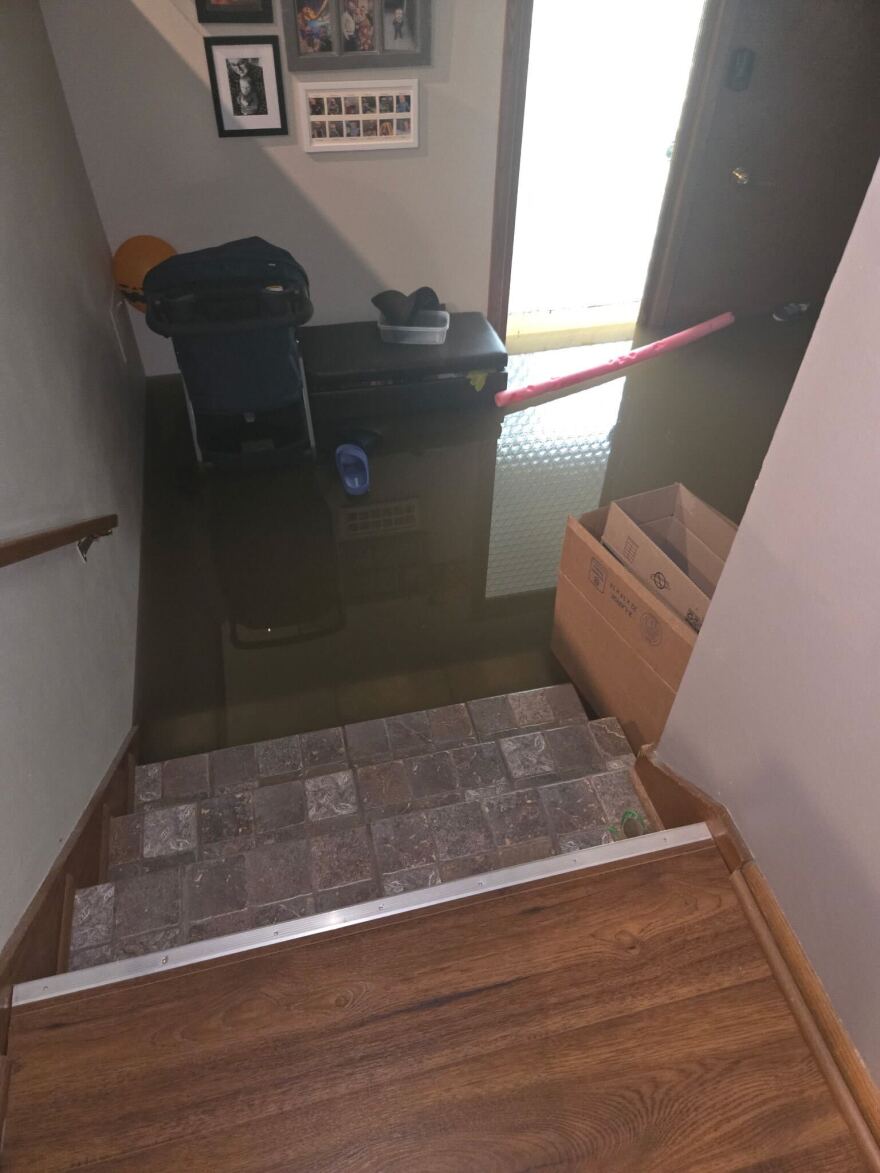 Water filled Young's home following the weekend storm. The family used the stairs to monitor the water for any rising.