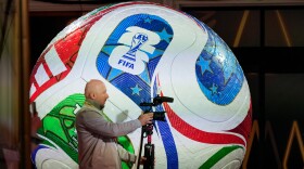A member of the media works prior to the final draw for the 2026 soccer World Cup at the Kennedy Center in Washington, Thursday, Dec. 4, 2025.