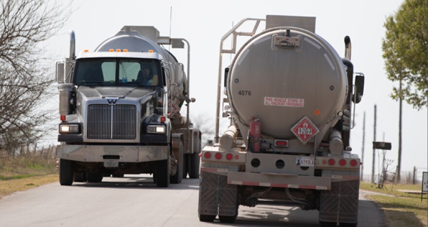 Trucks pass each other along a rural road just off south of Kingfisher.