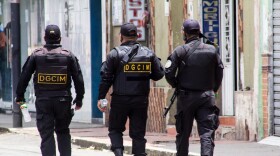 Venezuelan military walk down the street