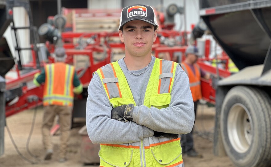 Carter Vigue, 17, works at Porter Farms during the annual harvest break in Aroostook County. His job is "racking potatoes" which involves picking out rocks, stems and rotten potatoes from the freshly harvested spuds. "You're just trying to make the cleanest load to get into the storage," he said.