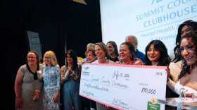 Summit County Clubhouse staff, members, and board members celebrate their award.